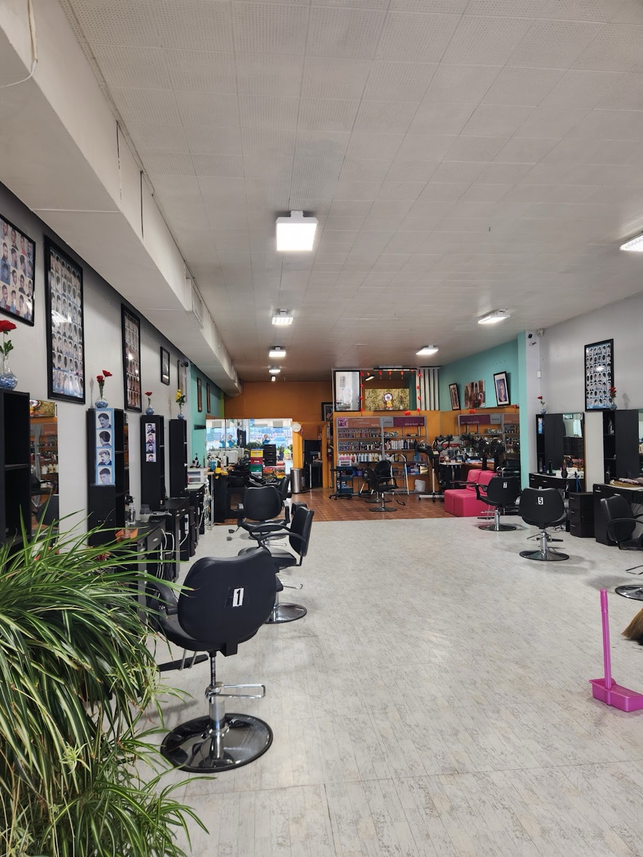 Bright CD Hair Salon interior with styling chairs and stations