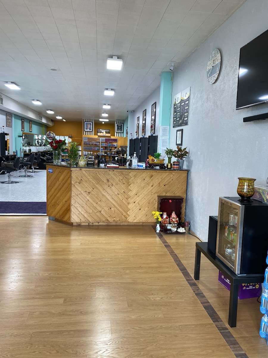 Warm wood reception desk at CD Hair Salon