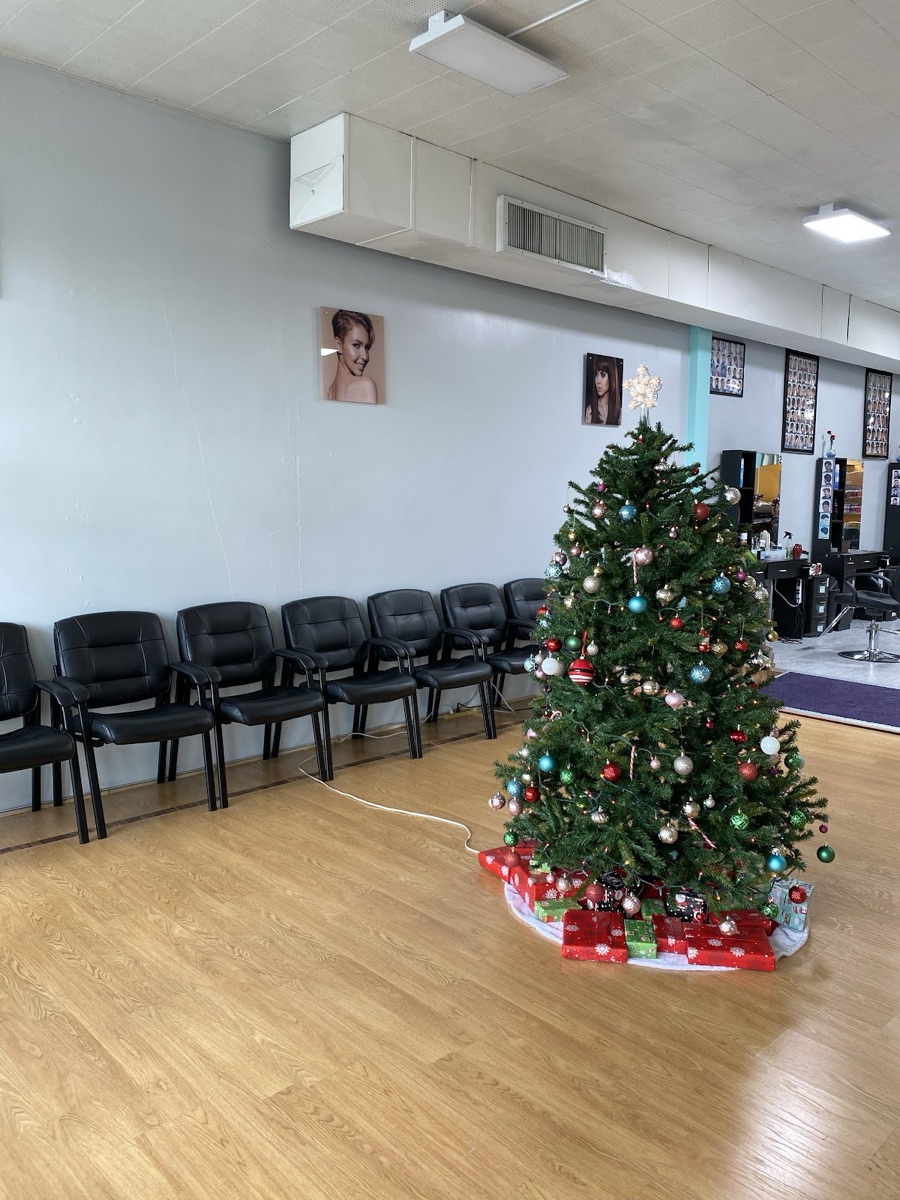 Comfortable waiting area at CD Hair Salon, decorated for the holidays